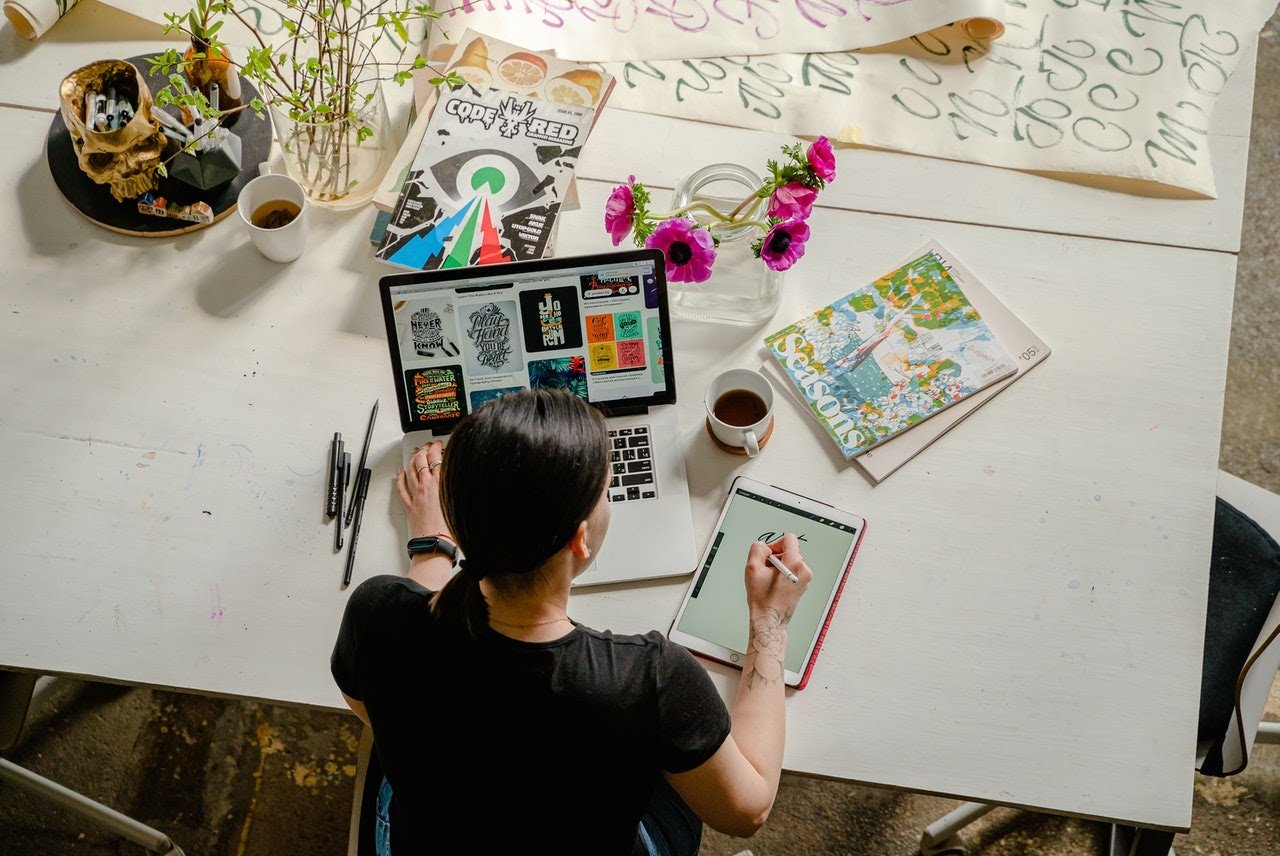 woman-working-on-laptop-and-tablet-in-demand-skills