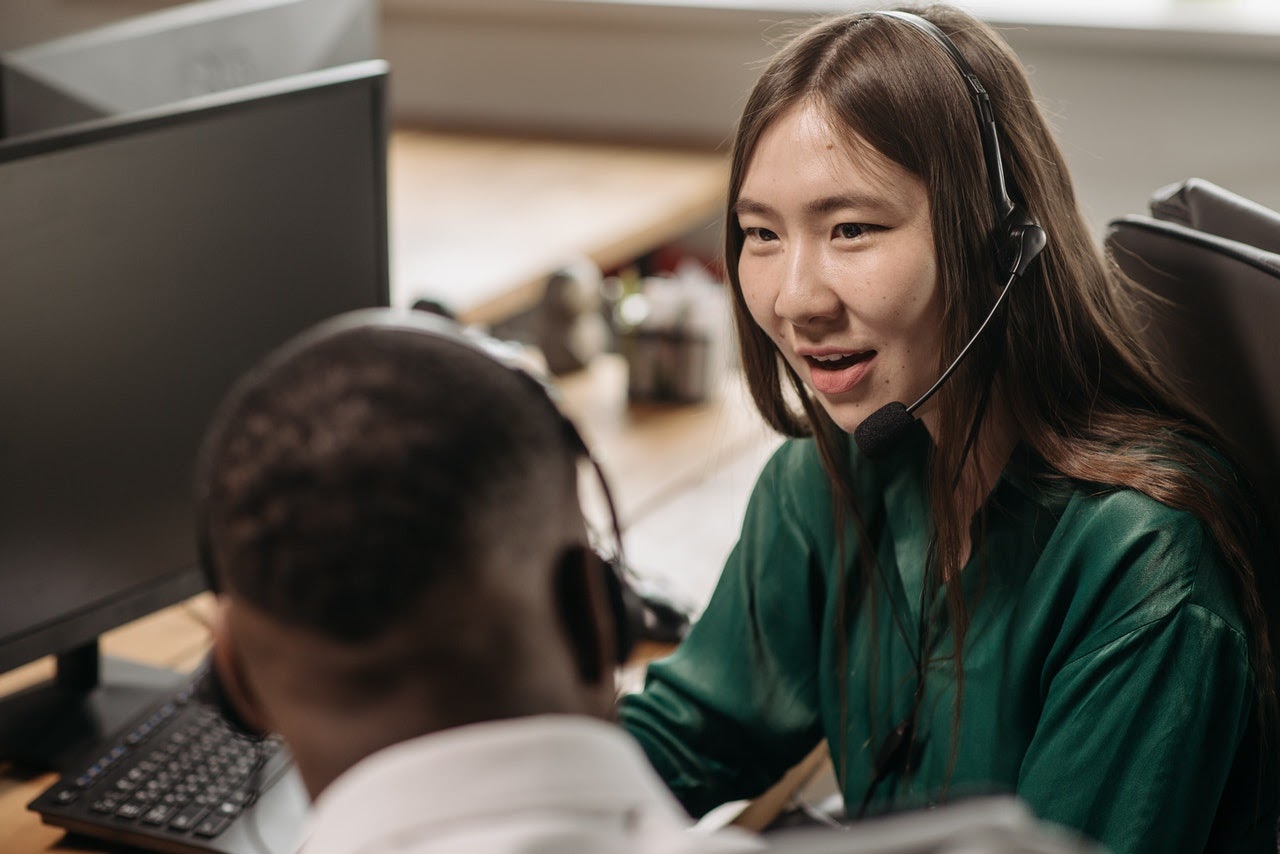 woman-and-man-talking-in-office-in-demand-skills