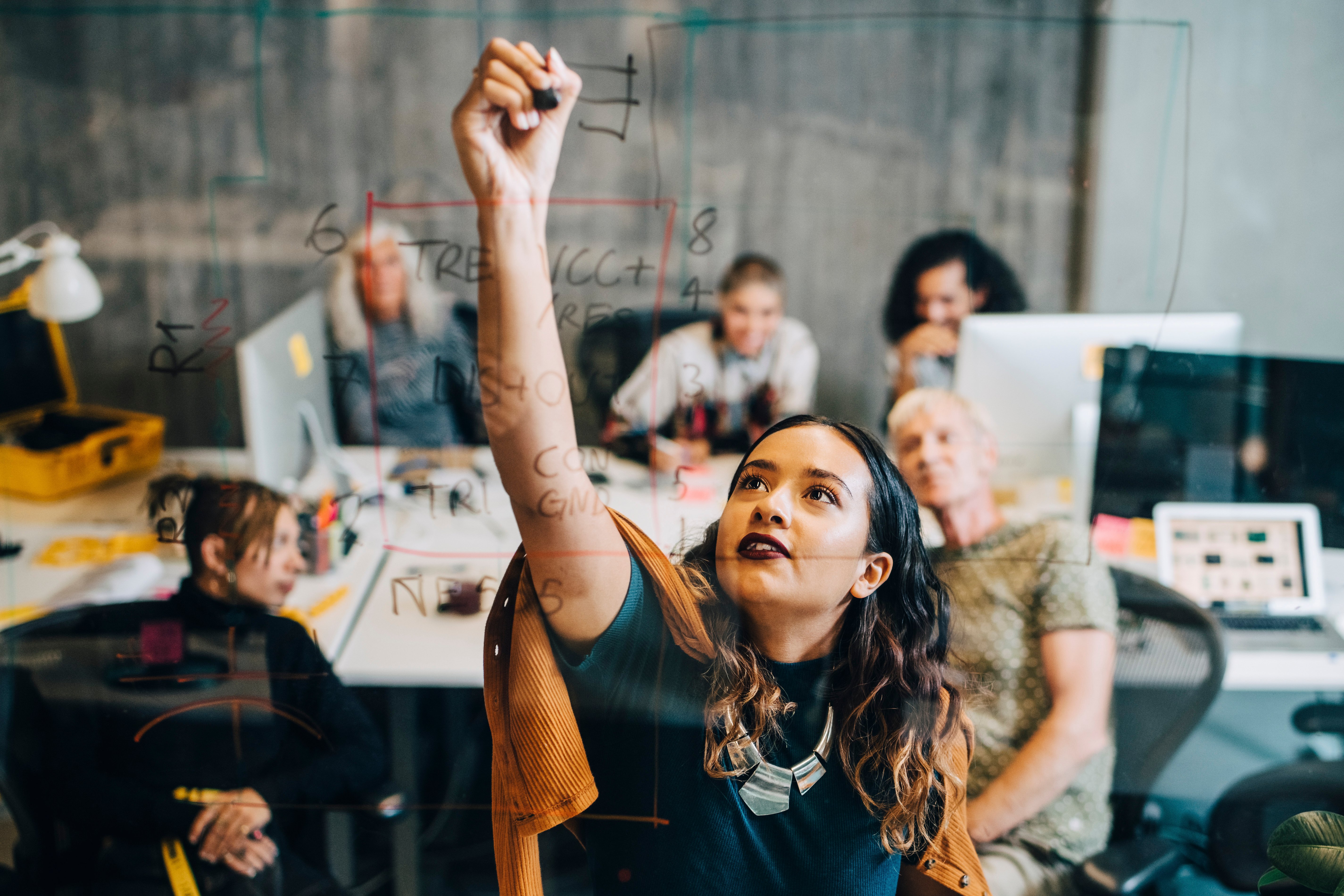 woman drawing her career plan on a whiteboard