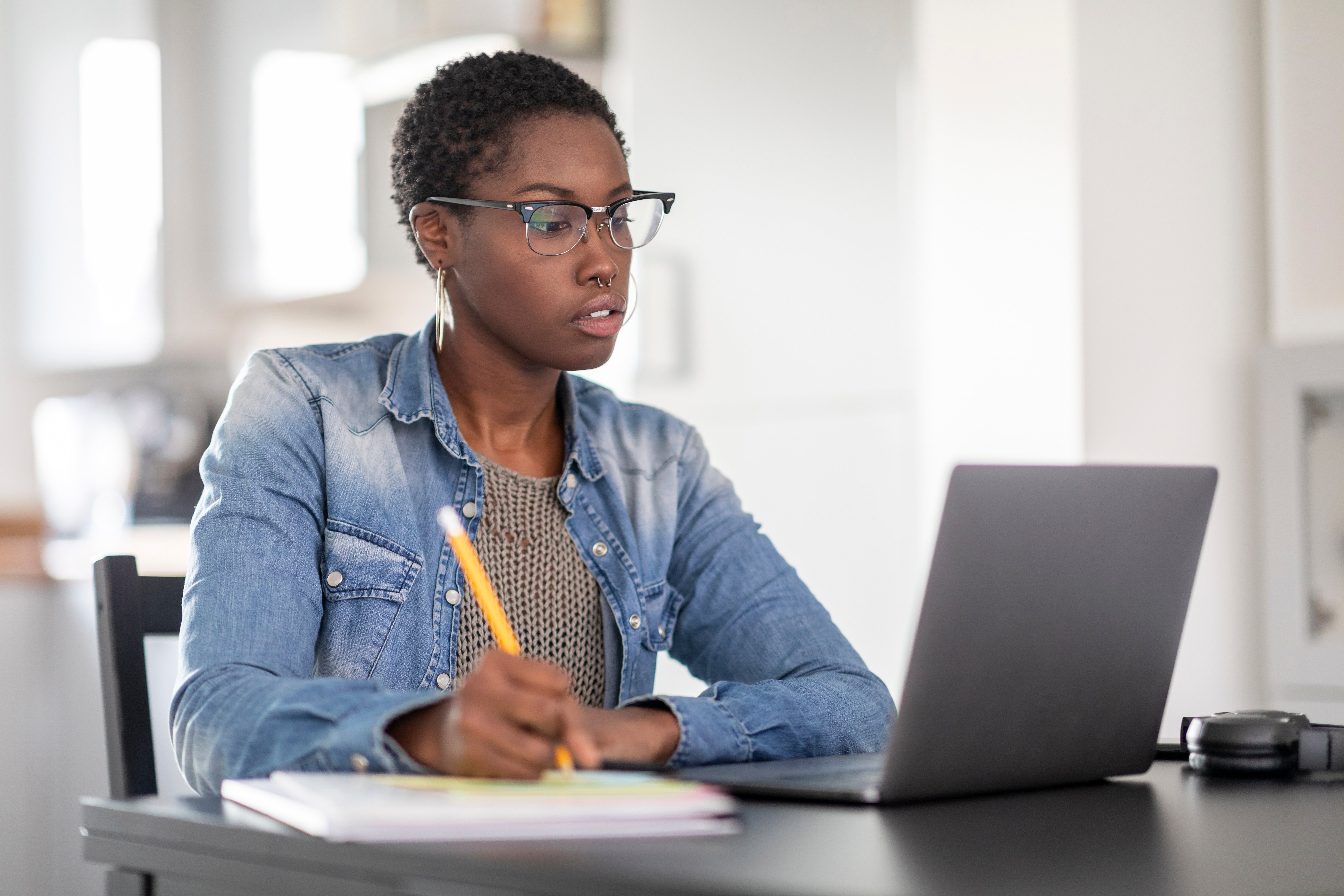 woman writing her career plan on a notebook