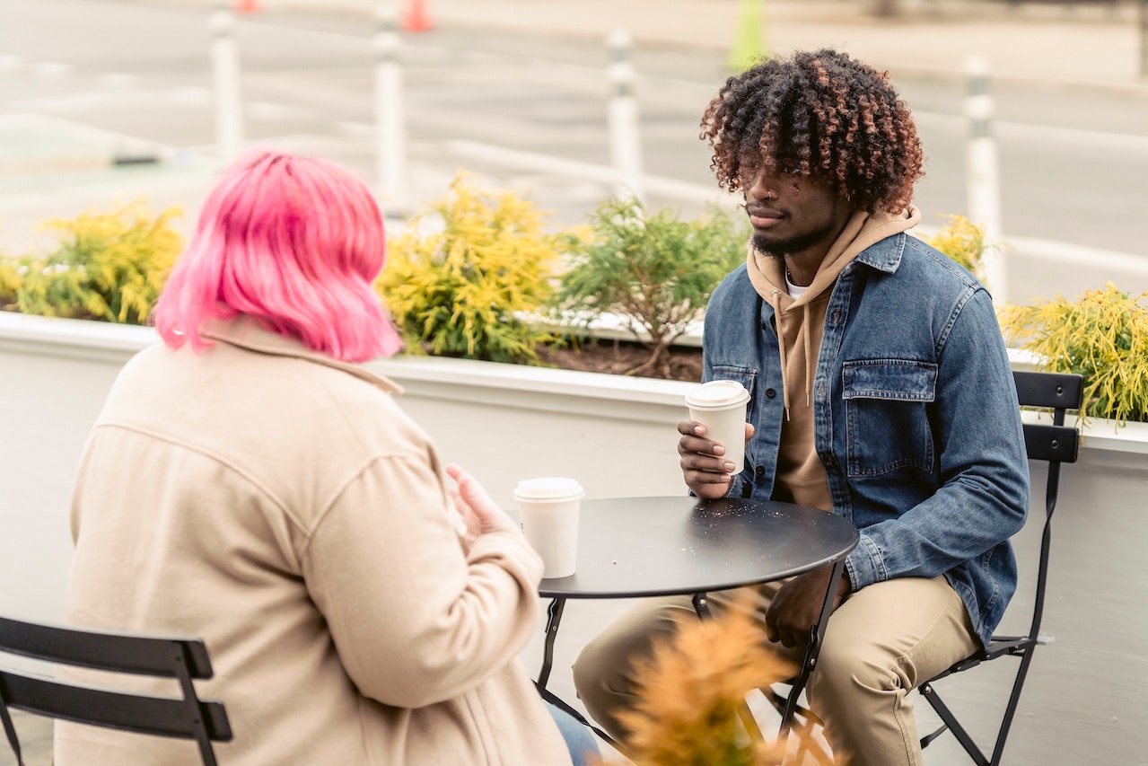 man-listening-to-his-friend-while-having-coffee-outdoors-what-is-an-empath