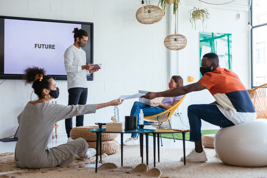 team-in-masks-gathered-in-a-meeting-employee-retention