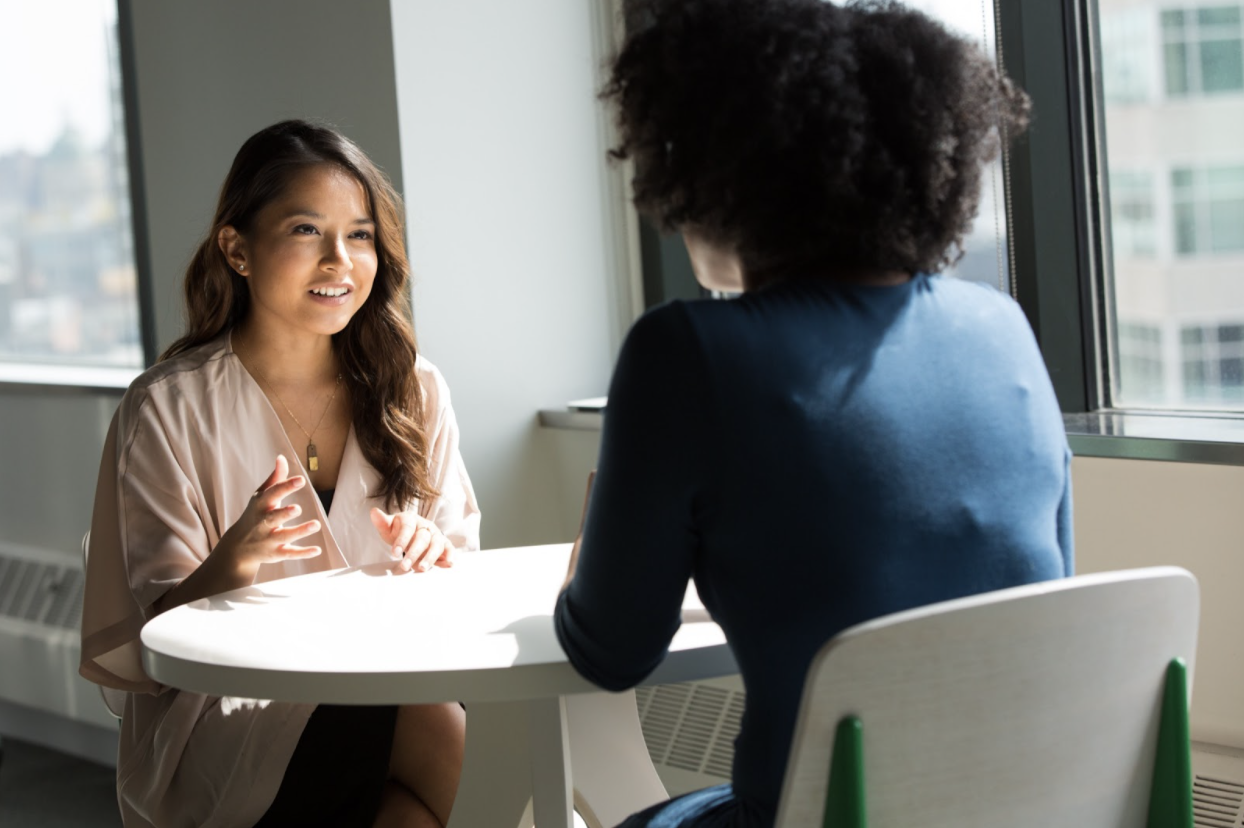 two-people-coffee-table-chat-career-paths